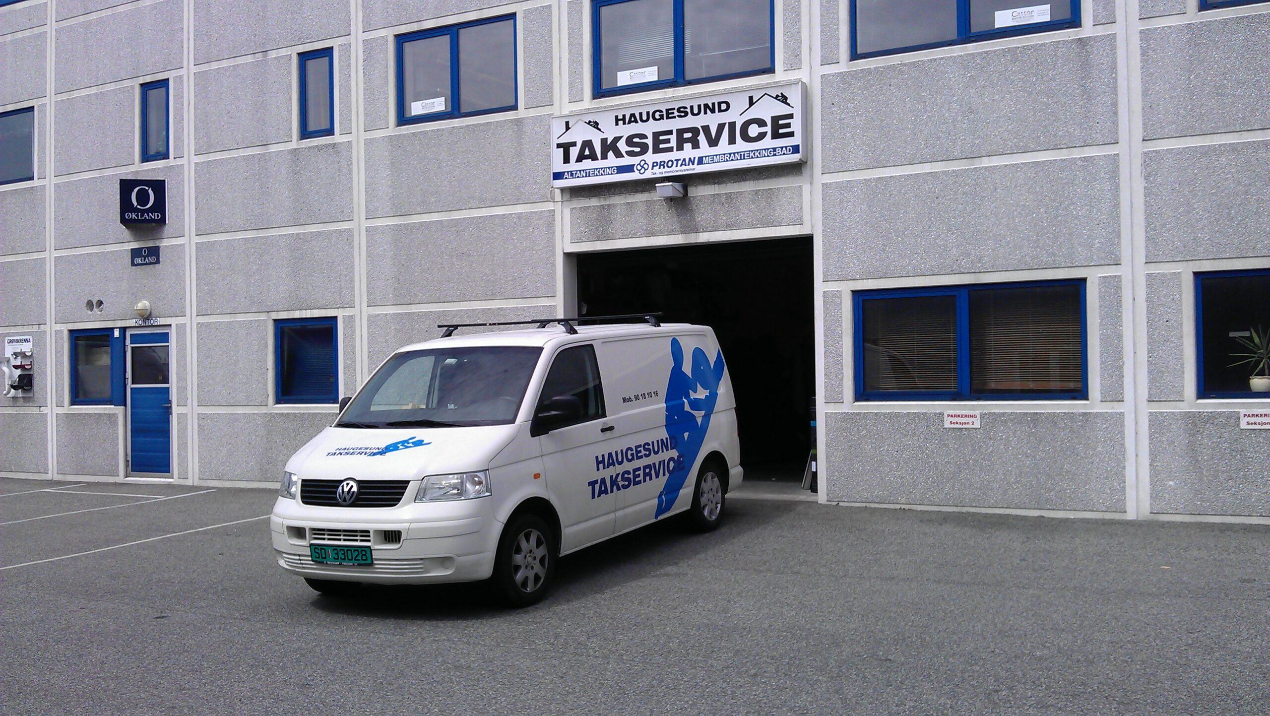The company van, lettered Haugesund Takservice, parked outside a workshop