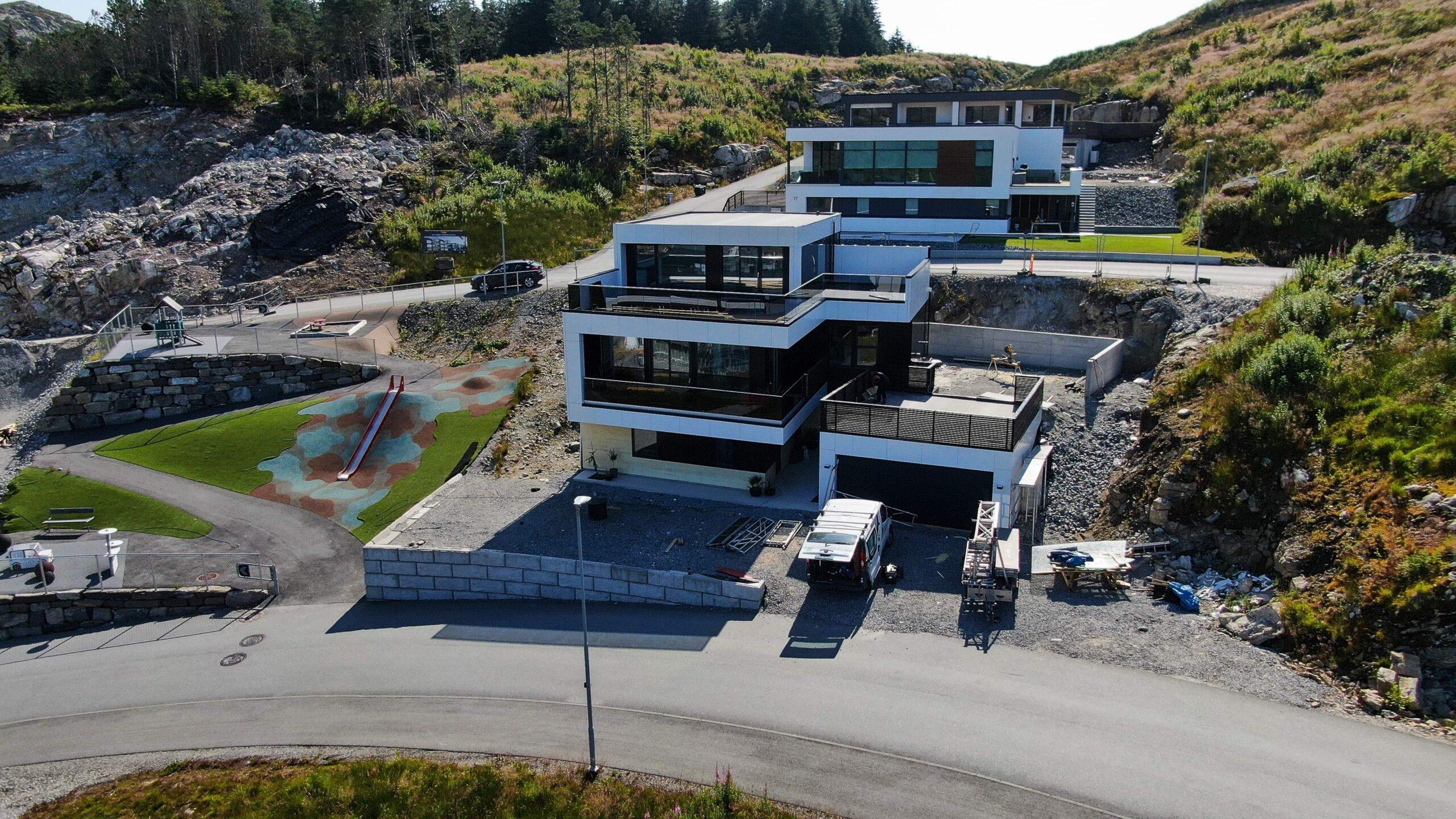 A modern house with a profiled roof, seen from the air